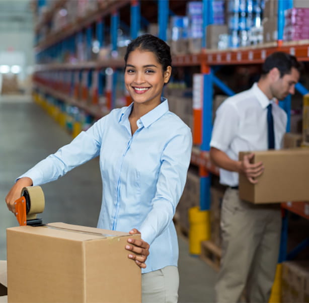 Warehouse workers moving boxes